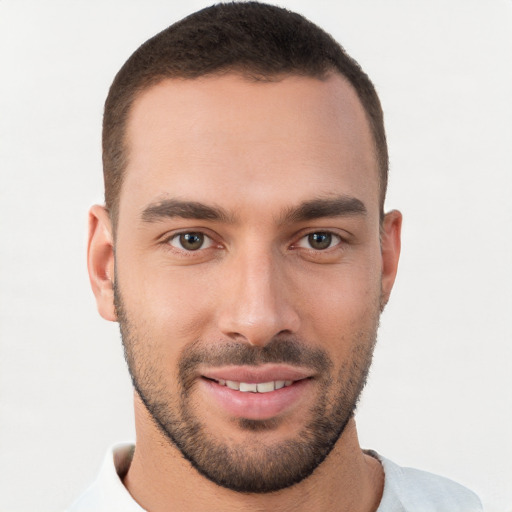 Joyful white young-adult male with short  brown hair and brown eyes