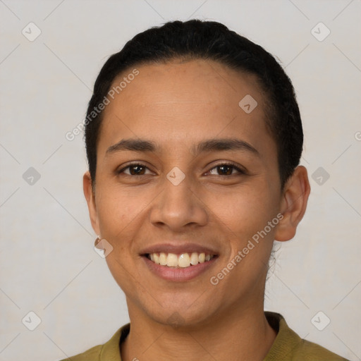 Joyful latino young-adult female with short  black hair and brown eyes