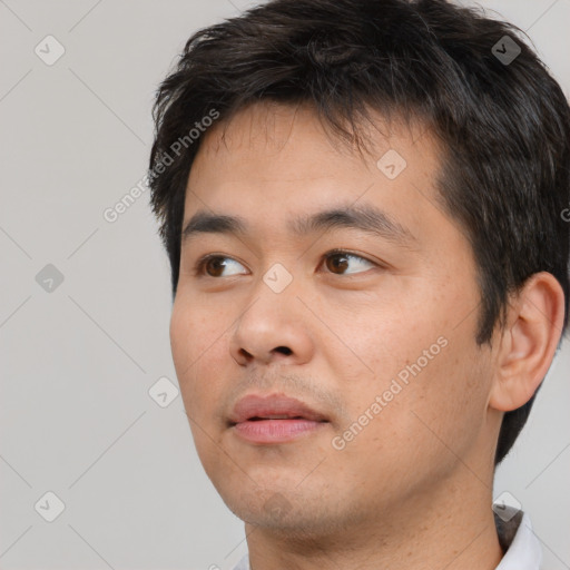 Neutral white young-adult male with short  black hair and brown eyes