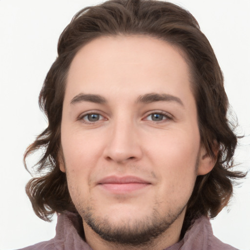 Joyful white young-adult male with medium  brown hair and brown eyes