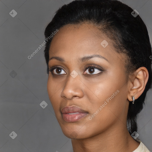 Joyful black young-adult female with short  black hair and brown eyes