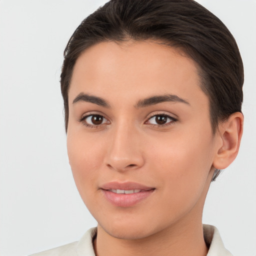 Joyful white young-adult female with short  brown hair and brown eyes