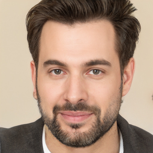 Joyful white young-adult male with short  brown hair and brown eyes