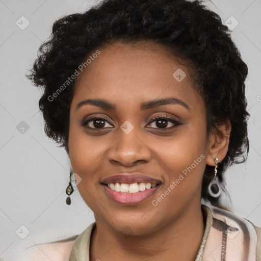 Joyful black young-adult female with long  brown hair and brown eyes