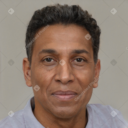 Joyful black adult male with short  brown hair and brown eyes