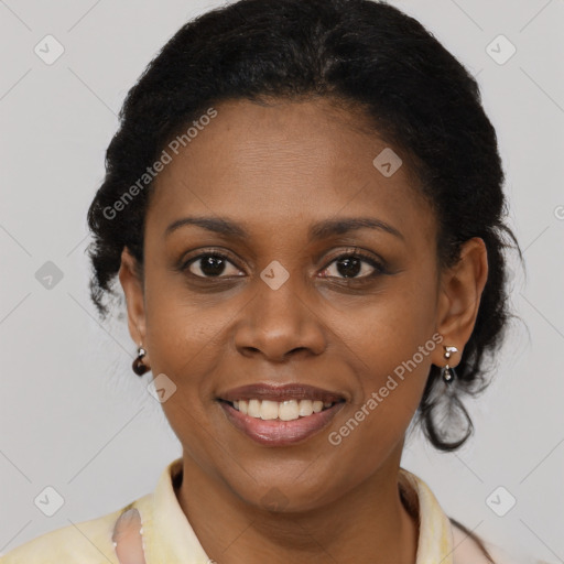 Joyful black young-adult female with short  brown hair and brown eyes