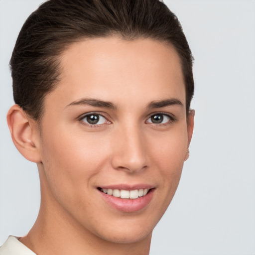 Joyful white young-adult female with short  brown hair and brown eyes