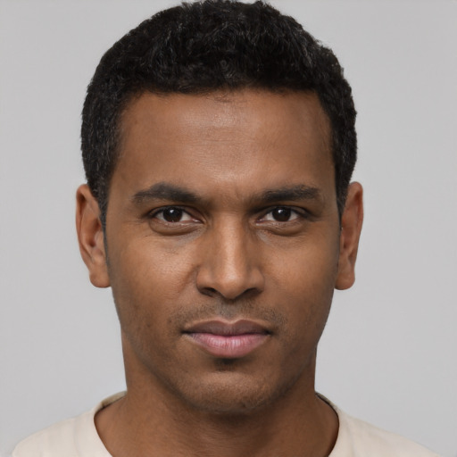 Neutral black young-adult male with short  black hair and brown eyes