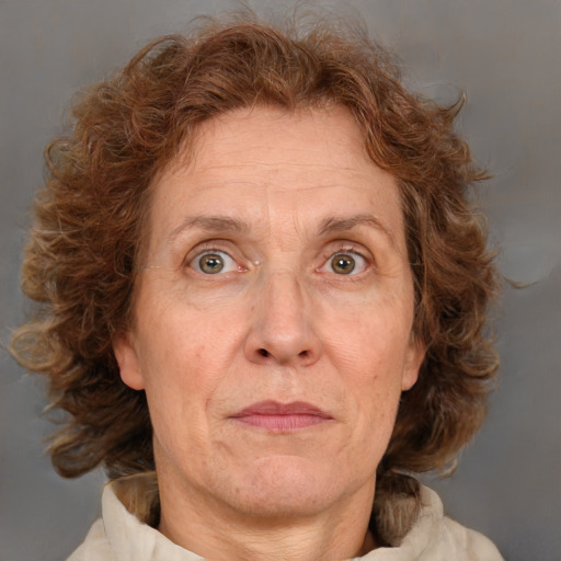 Joyful white adult female with medium  brown hair and green eyes