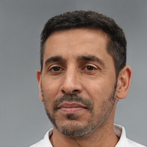 Neutral latino adult male with short  black hair and brown eyes