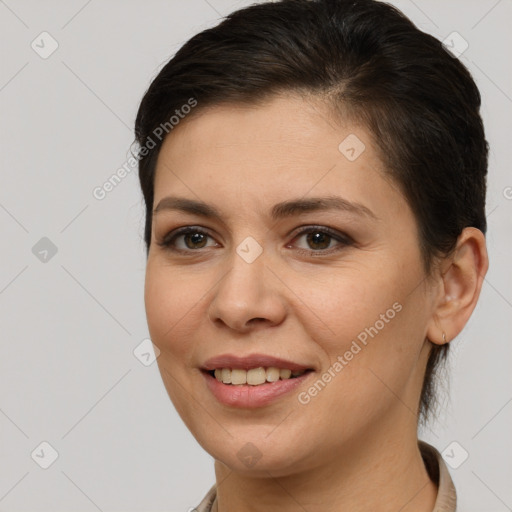 Joyful white young-adult female with short  brown hair and brown eyes