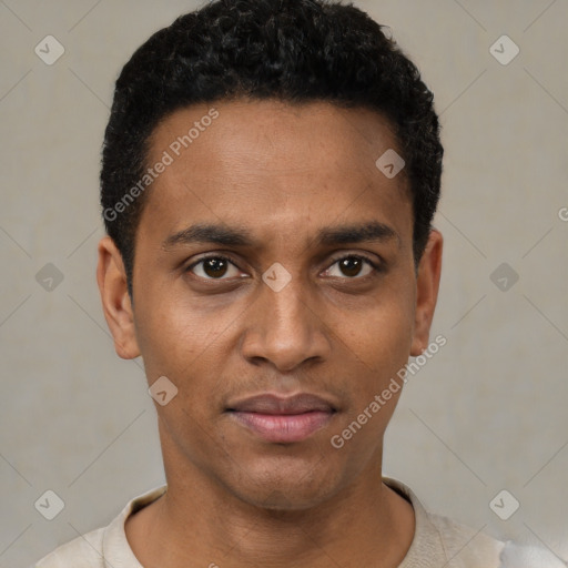 Joyful black young-adult male with short  black hair and brown eyes