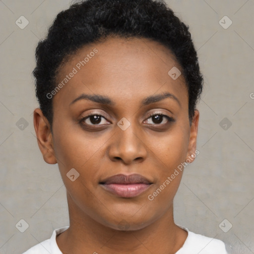 Joyful black young-adult female with short  black hair and brown eyes