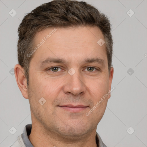 Joyful white adult male with short  brown hair and grey eyes