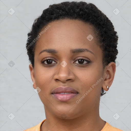 Joyful black young-adult female with short  brown hair and brown eyes