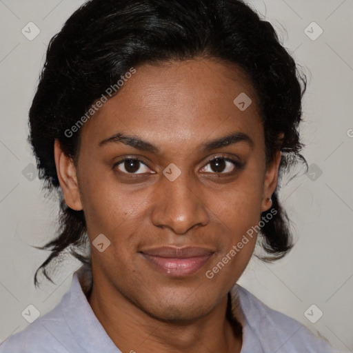 Joyful black adult female with medium  brown hair and brown eyes