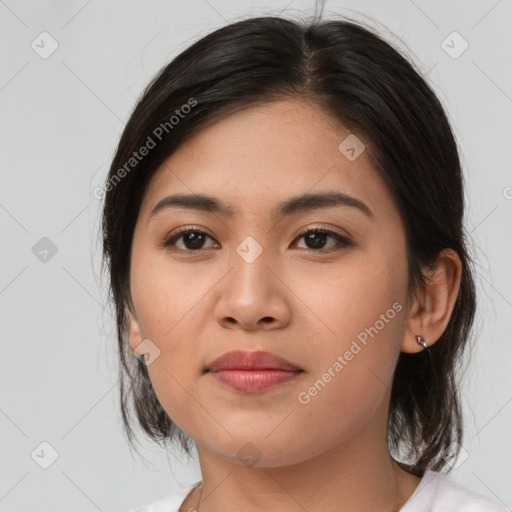 Joyful asian young-adult female with medium  brown hair and brown eyes