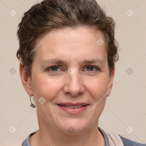 Joyful white adult female with short  brown hair and grey eyes