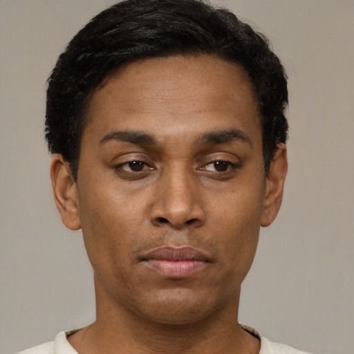 Neutral latino young-adult male with short  black hair and brown eyes