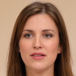 Joyful white young-adult female with long  brown hair and green eyes