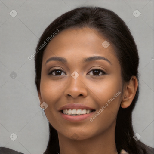 Joyful latino young-adult female with long  brown hair and brown eyes