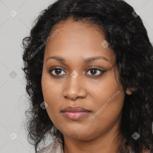 Joyful black young-adult female with long  black hair and brown eyes