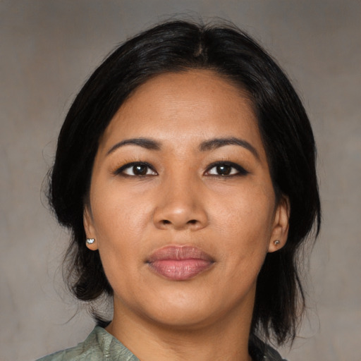 Joyful asian young-adult female with medium  black hair and brown eyes