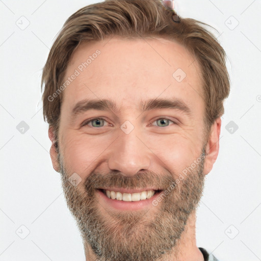 Joyful white adult male with short  brown hair and grey eyes