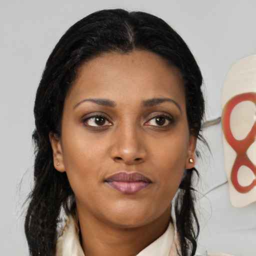 Neutral black young-adult female with medium  black hair and brown eyes