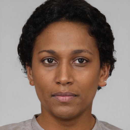 Neutral latino young-adult female with short  brown hair and brown eyes