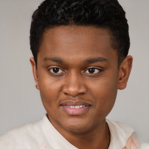 Joyful black young-adult male with short  brown hair and brown eyes
