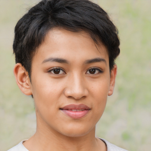 Joyful latino young-adult female with short  brown hair and brown eyes