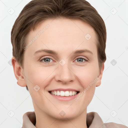 Joyful white young-adult female with short  brown hair and grey eyes