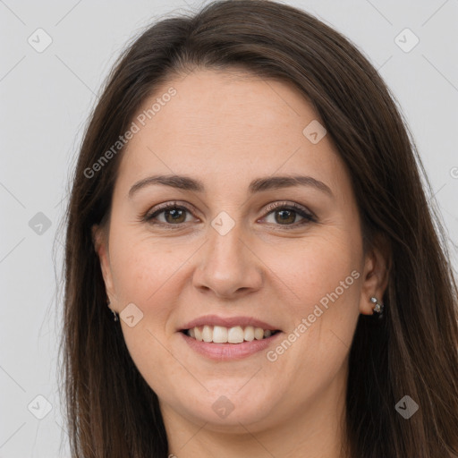 Joyful white young-adult female with long  brown hair and grey eyes