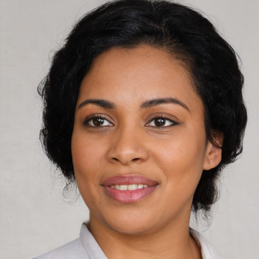 Joyful latino young-adult female with medium  black hair and brown eyes