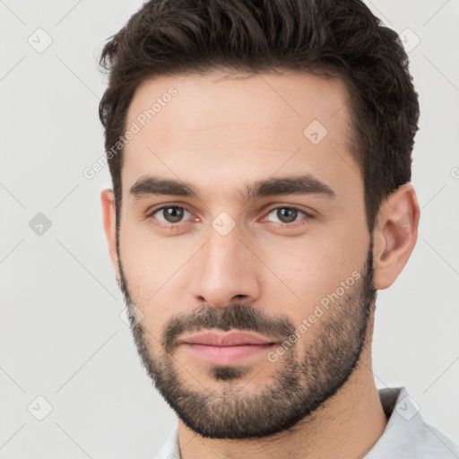 Neutral white young-adult male with short  brown hair and brown eyes