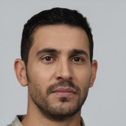 Neutral latino young-adult male with short  brown hair and brown eyes