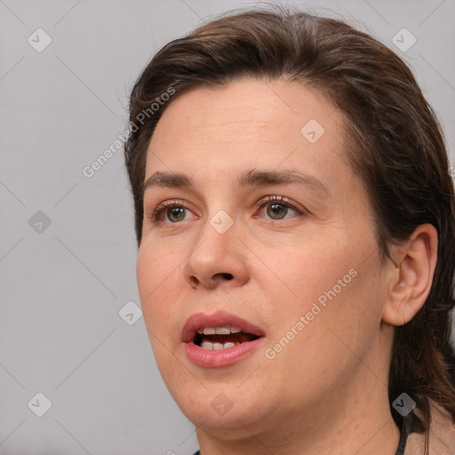 Joyful white young-adult female with medium  brown hair and brown eyes