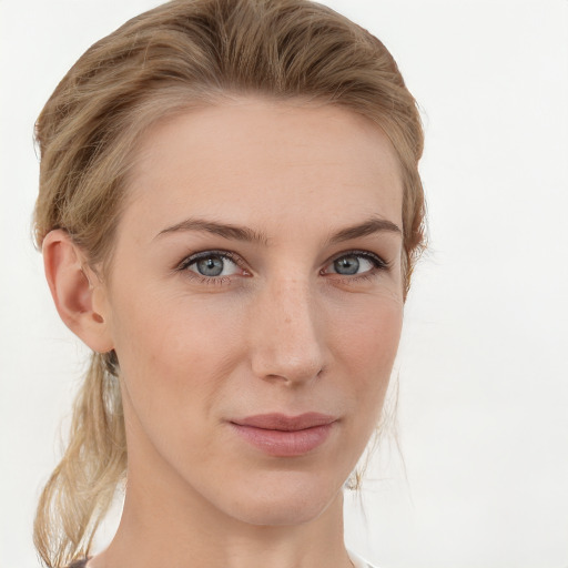 Joyful white young-adult female with medium  brown hair and blue eyes