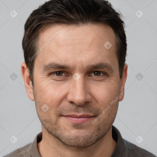 Joyful white adult male with short  brown hair and brown eyes