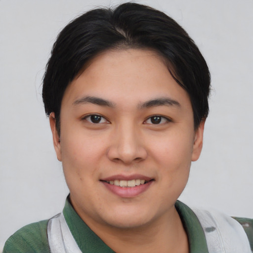 Joyful asian young-adult female with short  brown hair and brown eyes