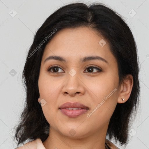 Joyful latino young-adult female with medium  brown hair and brown eyes