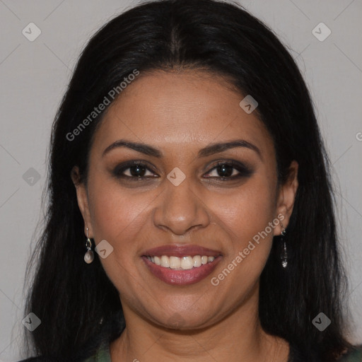 Joyful black young-adult female with long  brown hair and brown eyes