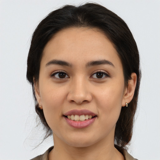 Joyful white young-adult female with medium  brown hair and brown eyes