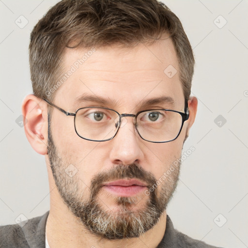 Neutral white adult male with short  brown hair and grey eyes