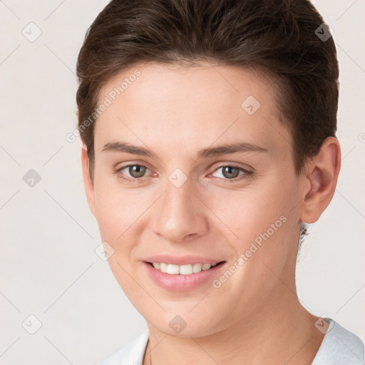 Joyful white young-adult female with short  brown hair and brown eyes