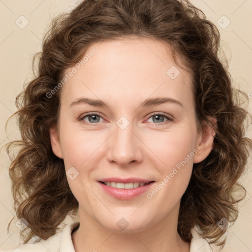 Joyful white young-adult female with medium  brown hair and green eyes