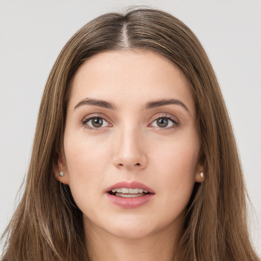 Neutral white young-adult female with long  brown hair and brown eyes