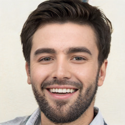 Joyful white young-adult male with short  black hair and brown eyes