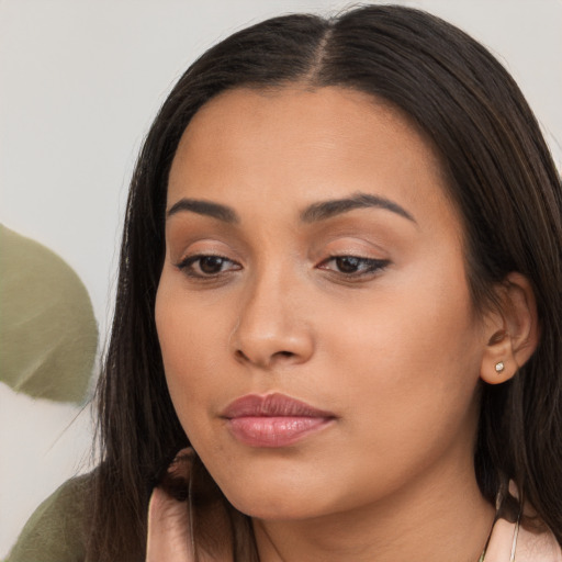 Neutral latino young-adult female with long  brown hair and brown eyes